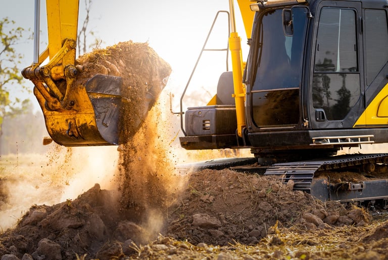 Close-up of excavator at construction site. Backhoe digging soil for earthwork and construction business.