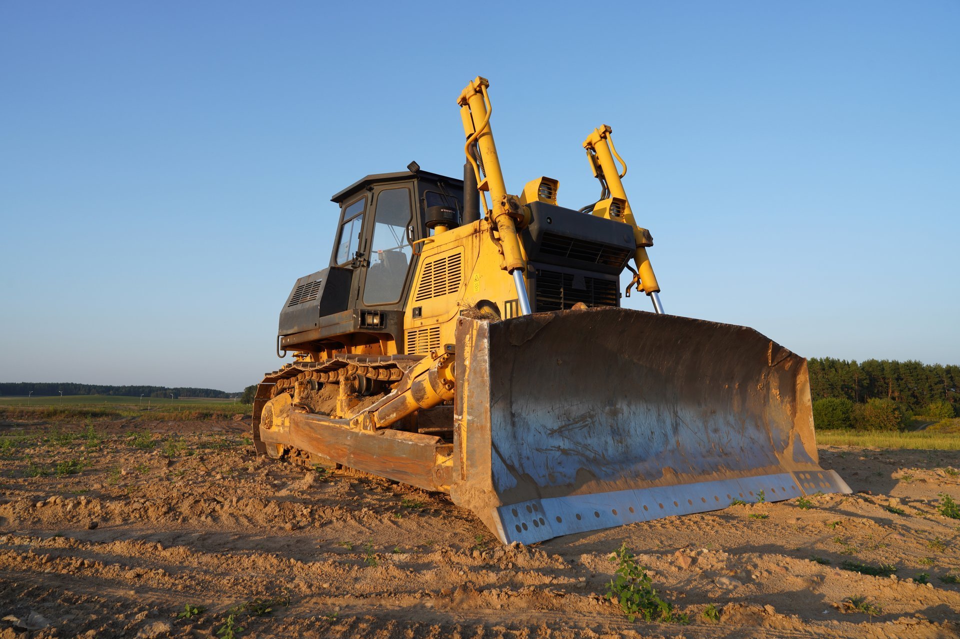 Dozer at construction site, utility trenching. Bulldozer at road construction.